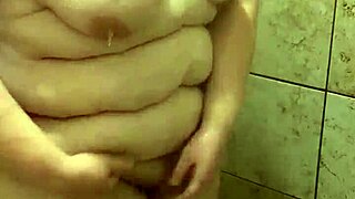 Curvy amateur bbw wife gets caught solo in shower with natural tits