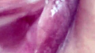 Woman uses long glass dildo for solo play in homemade video