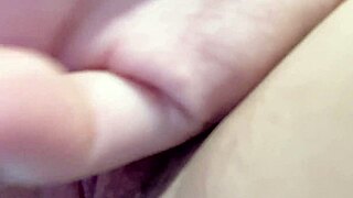 Woman uses long glass dildo for solo play in homemade video