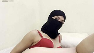 Hey, watch this shy Arab girl in niqab gently masturbate her juicy pussy.