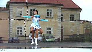 two nice majorettes practice routines together in the sunny park field