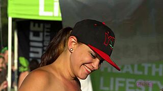 Rock fest flashers show off sexy moves behind the scenes at daytime party.