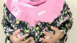 Adik tiri in hijab engages in solo activity for her partner with dildo toys