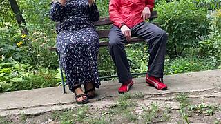 Hot MILF Jerks Off Huge Dick into Glass on Park Bench