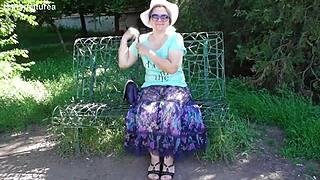 Hairy mature woman walks in see-through dress flashing beaver outdoors