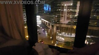 Petite amateur babe masturbating clit close up in public outdoor spot in front of hotel window to orgasm