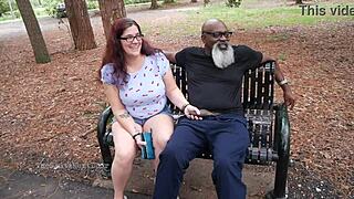 This nerdy milf was out in the park, casually stroking and sucking on a black dick.