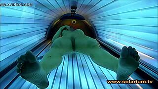 Wow, check out this beautiful woman masturbating wildly on the solarium cam!