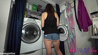 Watch me pull clothes from dryer wearing tiny shorts showing my big tits