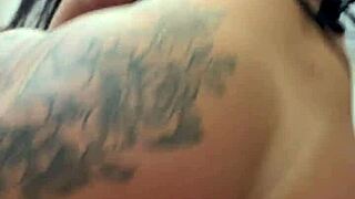 sultry tattooed brazilian milf fists her huge ass in black bodysuit closeup