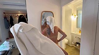 Two women rub cream on naked bodies