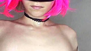 Moaning housewife in maid corset masturbates with dildo and mask.