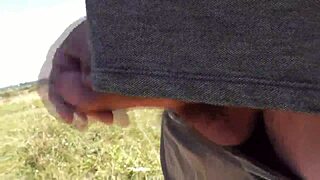 A pervert spots beautiful sexy blonde sunbathing naked on wild beach and jerks off publicly.