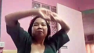 dancing asian doll twirls playfully in homemade amateur clip