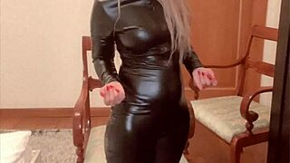 singer goaldigger in latex catsuit dominates with feet glasses financial findom song