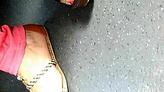 mature woman shows candid feet in wedges and sandals