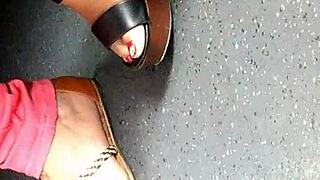 mature woman shows candid feet in wedges and sandals