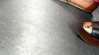 mature woman shows candid feet in wedges and sandals