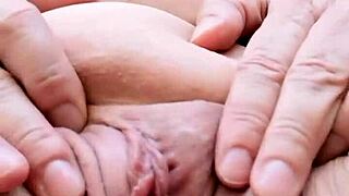 a busty granny in lingerie teases with her shaved pussy close-up