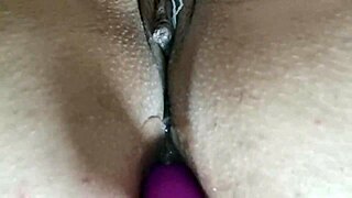 mature woman enjoys toy in her rear with vibrator leading to climax