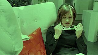 Beautiful brunette spreads legs on bed fingering shaved pussy deeply