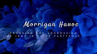 Don't you love her legs crossing in shiny black pantyhose?