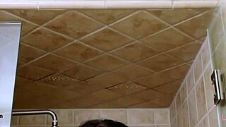 brunette fashion model steps into steamy shower for refreshing rinse