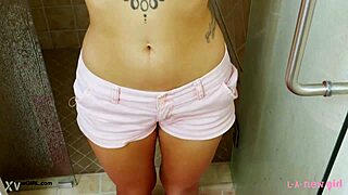 brunette fashion model steps into steamy shower for refreshing rinse