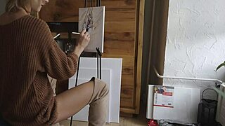 Blonde babe in boots paints her pretty pussy like a flower