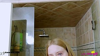 Bright-eyed blonde steps into steamy shower for intimate photoshoot interview