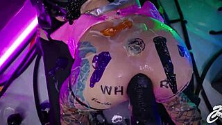 A woman experiments with massive toy stretching intimate areas deeply. She pushes body limits in solo narrative play.