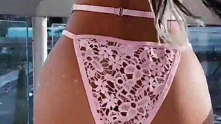 Teasing in pink lingerie drives me wild with sexy latina curves on display.