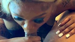 pretty ebony face slurps big black cock