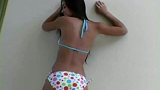 brunette flashes bikini tits in hot photoshoot