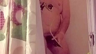 she strokes big cock under hot shower streams.