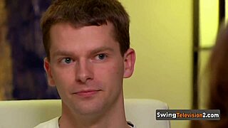 A swinger couple explores each other's bodies intimately during casting