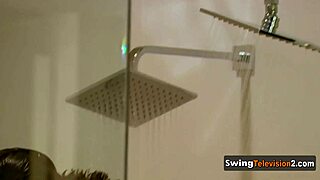 A swinger couple explores each other's bodies intimately during casting