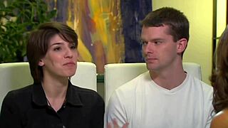 A swinger couple explores each other's bodies intimately during casting