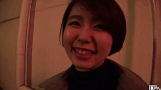 japanese girl walks alley with remote vibe buzzing inside her