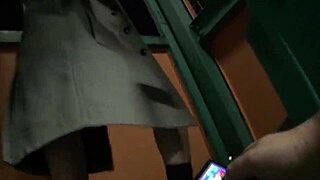 japanese girl walks alley with remote vibe buzzing inside her