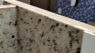 Guy masturbates with handjob in public bathroom toilet