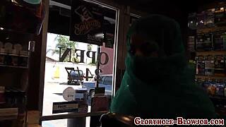 Arab babe slurps massive black cock at gloryhole