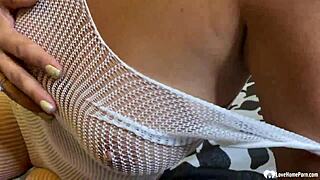 Brunette milf in fishnets spreads legs teases pussy closeup solo
