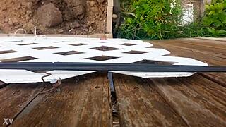 She presses against the fence for intense outdoor fucking session