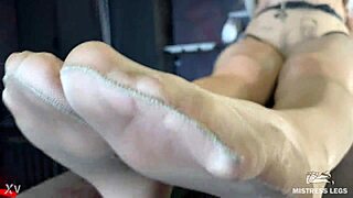 mistress's sexy nyloned feet tease closeup on desk