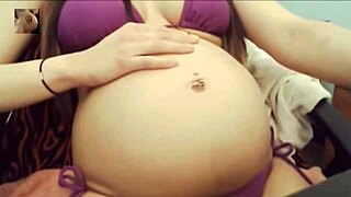 sexy pregnant belly pops in tight bikini for steamy tease