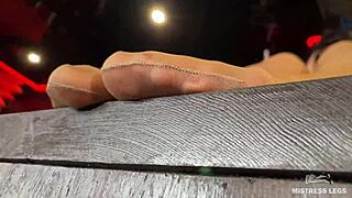 mistress's sexy nyloned feet tease closeup on desk