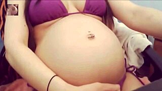 sexy pregnant belly pops in tight bikini for steamy tease