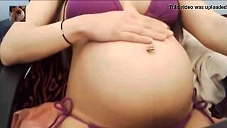 sexy pregnant belly pops in tight bikini for steamy tease