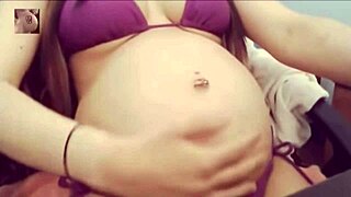 sexy pregnant belly pops in tight bikini for steamy tease